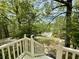 Scenic view from the top of the front porch steps, landscaped yard leading to the street at 610 Coolsprings Ln, Woodstock, GA 30188