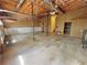 Large garage space with high ceilings, built-in shelving, and additional storage, offering functionality at 610 Coolsprings Ln, Woodstock, GA 30188