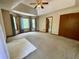 Spacious main bedroom with neutral carpet, many windows, and a double door closet at 610 Coolsprings Ln, Woodstock, GA 30188