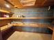 Well-organized storage room featuring sturdy wooden shelving and concrete walls for durability at 610 Coolsprings Ln, Woodstock, GA 30188
