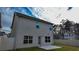 A spacious backyard with a well-maintained lawn and neutral-colored home, creating an inviting outdoor space at 11978 Quail Rd, Hampton, GA 30228