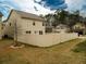 View of the backyard and fence surrounding the back of the home at 11978 Quail Rd, Hampton, GA 30228