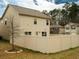 View of the backyard and fence surrounding the back of the home at 11978 Quail Rd, Hampton, GA 30228