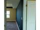 Bedroom with carpet, blue accent wall, and white trim at 11978 Quail Rd, Hampton, GA 30228