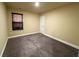 Bedroom with neutral-colored walls and plush carpeting, a window with blinds, and a white door at 11978 Quail Rd, Hampton, GA 30228