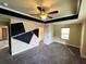 Bright bedroom features decorative wall paint, tray ceiling with fan and ensuite bathroom at 11978 Quail Rd, Hampton, GA 30228