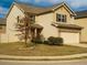 Charming two-story home featuring a two-car garage and well-maintained front yard at 11978 Quail Rd, Hampton, GA 30228
