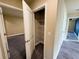 Hallway with bedroom door, closet, and open doorway to the bedroom at 11978 Quail Rd, Hampton, GA 30228
