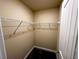 Walk-in closet with ample shelving and carpeting at 11978 Quail Rd, Hampton, GA 30228