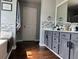 The bathroom has a modern vanity, a large mirror, decorative tile accents and natural light at 3302 Willow Meadow Ln, Douglasville, GA 30135