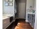 This bathroom features a stylish vanity, modern fixtures, elegant tile accents and hardwood floors at 3302 Willow Meadow Ln, Douglasville, GA 30135