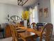Formal dining room featuring hardwood table set with seating and a decorative light fixture at 3302 Willow Meadow Ln, Douglasville, GA 30135