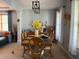 Comfortable dining area featuring a wooden table with seating for six, and a view of the living room at 3302 Willow Meadow Ln, Douglasville, GA 30135