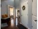 Welcoming entryway with hardwood floors, stylish decor, and convenient coat closet at 3302 Willow Meadow Ln, Douglasville, GA 30135