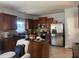 Charming kitchen featuring stainless steel appliances, granite countertops and brown cabinets at 3302 Willow Meadow Ln, Douglasville, GA 30135