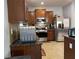 Well-lit kitchen with stainless steel appliances, granite countertops and brown cabinets at 3302 Willow Meadow Ln, Douglasville, GA 30135