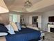 Spacious main bedroom featuring a ceiling fan, sitting area, and ample natural light at 3302 Willow Meadow Ln, Douglasville, GA 30135