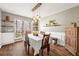 Dining area featuring modern lighting, hardwood floors and shelving at 4210 Hamilton Walk Dr, Buford, GA 30519