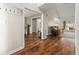 Hardwood floors and neutral walls offer a view to the living room and dining room at 4210 Hamilton Walk Dr, Buford, GA 30519