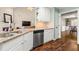 Kitchen boasts granite countertops, stainless steel appliances, and seamlessly connects to the living and dining areas at 4210 Hamilton Walk Dr, Buford, GA 30519