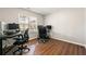 Bright home office features hardwood floors, natural light, and dual workstation setups at 4210 Hamilton Walk Dr, Buford, GA 30519