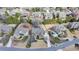 Expansive aerial view of a landscaped home featuring a circular driveway and lush, mature trees in a desirable neighborhood at 5340 Cole Creek Ln, Cumming, GA 30040