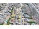 Aerial view showcasing the property boundaries of a home nestled in a neighborhood with mature trees and meticulously kept lawns at 5340 Cole Creek Ln, Cumming, GA 30040
