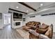 Inviting basement with a fireplace, shiplap walls, and wood-look floors at 5340 Cole Creek Ln, Cumming, GA 30040