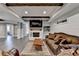 Finished basement showcasing a cozy seating area, fireplace, and stylish finishes at 5340 Cole Creek Ln, Cumming, GA 30040