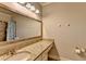 Neutral bathroom featuring a granite vanity, tub and shower combination, and bronze fixtures at 5340 Cole Creek Ln, Cumming, GA 30040