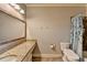 Neutral bathroom featuring a granite vanity, tub and shower combination, and bronze fixtures at 5340 Cole Creek Ln, Cumming, GA 30040