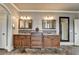 Bathroom with double vanity, granite countertop, and dark wood cabinets at 5340 Cole Creek Ln, Cumming, GA 30040