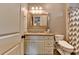 Bathroom with granite countertop, cabinet storage, toilet, and glass-enclosed shower at 5340 Cole Creek Ln, Cumming, GA 30040