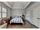 Bedroom boasts tray ceilings, hardwood floors, natural light, and dual closets at 5340 Cole Creek Ln, Cumming, GA 30040