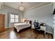 Bedroom featuring hard wood floors, chandelier, and large window at 5340 Cole Creek Ln, Cumming, GA 30040