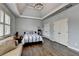 Beautiful primary suite features trey ceilings, hardwood floors, and multiple windows at 5340 Cole Creek Ln, Cumming, GA 30040