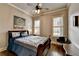 Comfortable bedroom features hardwood floors, neutral walls, and a ceiling fan at 5340 Cole Creek Ln, Cumming, GA 30040