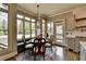 Cozy breakfast nook with large windows offering a scenic view and natural light at 5340 Cole Creek Ln, Cumming, GA 30040