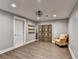 Spacious finished basement with neutral paint, wood floors, and eclectic furnishings at 5340 Cole Creek Ln, Cumming, GA 30040