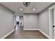 Open basement featuring wood floors, neutral colors, and modern lighting at 5340 Cole Creek Ln, Cumming, GA 30040