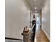 Bright hallway featuring hardwood floors, detailed trim, neutral paint and natural light at 5340 Cole Creek Ln, Cumming, GA 30040