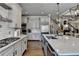 Gourmet kitchen with stainless appliances, gray cabinetry, white subway tile backsplash, and hardwood flooring at 5340 Cole Creek Ln, Cumming, GA 30040