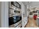 Modern kitchen boasts stainless steel appliances, including a built-in microwave and oven at 5340 Cole Creek Ln, Cumming, GA 30040
