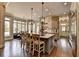 Gourmet kitchen featuring a large island, stainless steel appliances, and ample natural light at 5340 Cole Creek Ln, Cumming, GA 30040