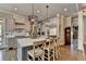 Modern kitchen with a large island, stainless steel appliances, and stylish finishes at 5340 Cole Creek Ln, Cumming, GA 30040