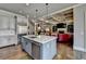 Spacious kitchen island with stainless steel appliances and white countertops, open to the living area at 5340 Cole Creek Ln, Cumming, GA 30040