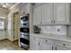 Updated kitchen boasts stainless steel appliances, modern cabinets, and sleek countertops, perfect for cooking at 5340 Cole Creek Ln, Cumming, GA 30040