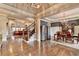 Open-concept living area with hardwood floors, a staircase, dining space, and a view to the Gathering room at 5340 Cole Creek Ln, Cumming, GA 30040