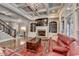 Spacious living room featuring a coffered ceiling, fireplace, and large windows at 5340 Cole Creek Ln, Cumming, GA 30040