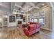 Bright living room with a fireplace, large windows, and hardwood floors at 5340 Cole Creek Ln, Cumming, GA 30040